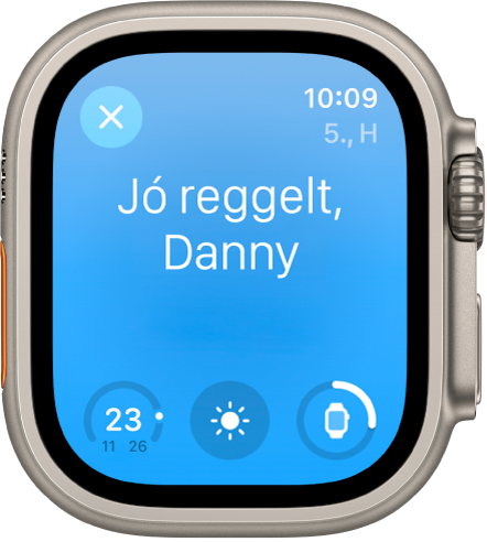Az Apple Watch az ébredési képernyővel. Felül a „Jó reggelt!” felirat olvasható. Alatta az akkumulátorszint látható.