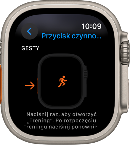 Ekran Przycisk czynności na Apple Watch Ultra, przedstawiający Trening jako przypisane działanie i aplikację. Jednokrotne naciśnięcie przycisku czynności powoduje otwarcie aplikacji Trening.
