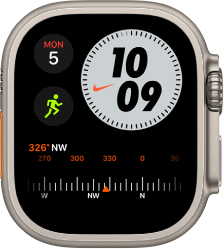 Številčnica Nike Compact prikazuje pripomoček Compass (Kompas) v zgornjem levem kotu, čas v zgornjem desnem kotu, pripomoček Workout (Vadba) v srednjem levem kotu in pripomoček Compass Heading (Smer kompasa) na dnu.
