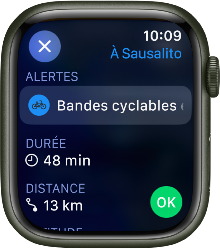 L’app Plans qui affiche les détails d’un trajet à vélo. Des alertes au sujet du trajet s’affichent dans le haut, puis le temps que prendra l’itinéraire et la distance qui vous sépare de la destination se trouvent en dessous. Un bouton OK se situe en bas à droite.