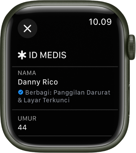Layar ID Medis di Apple Watch menampilkan nama dan umur pengguna. Tanda centang berada di bawah nama, menunjukkan ID Medis sedang dibagikan di layar terkunci. Tombol Tutup berada di kiri atas.