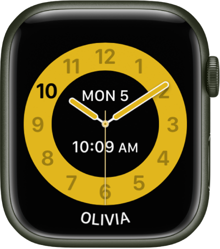 Laikrodžio ciferblate „Schooltime“ šalia centro rodomas analoginis laikrodis su data ir skaitmeniniu laiku. Asmens, kuris naudoja laikrodį, vardas yra apačioje.