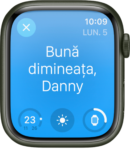 Apple Watch afișând ecranul de trezire. Cuvintele “Bună dimineața” apar în partea de sus. Nivelul bateriei este dedesubt.
