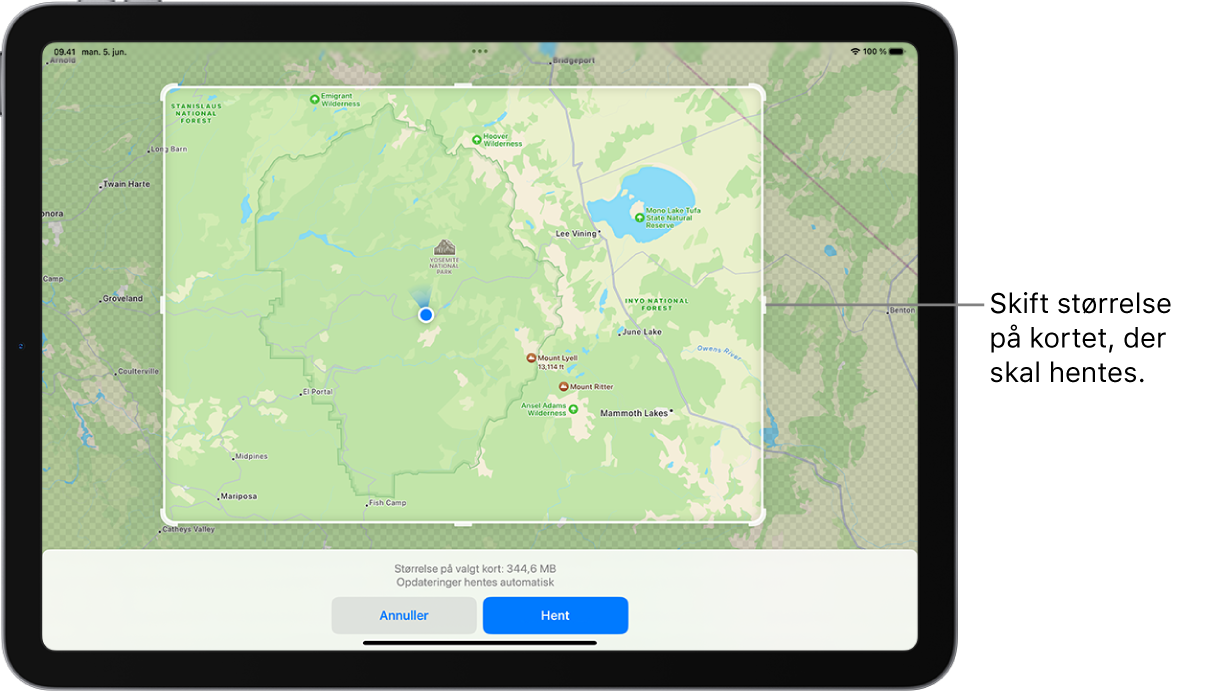 En iPad med et kort over en nationalpark. Parken er indrammet af et rektangel med håndtag, som kan flyttes for at ændre størrelsen på det kort, der skal hentes. Det valgte korts størrelse ved overførsel er angivet i bunden af kortet. Knapperne Annuller og Hent findes nederst på skærmen.