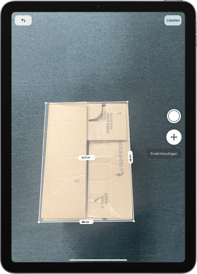 Ein Bildschirm, der die Messung der Abmessungen einer Box in der App „Maßband“ zeigt. Die Fläche der Box wird auf der Basis ihrer gemessenen Abmessungen berechnet.
