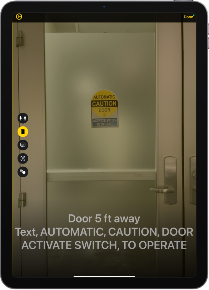 The Magnifier screen in Detection Mode showing a door. At the bottom is a description of how far away the door is and the text on it.