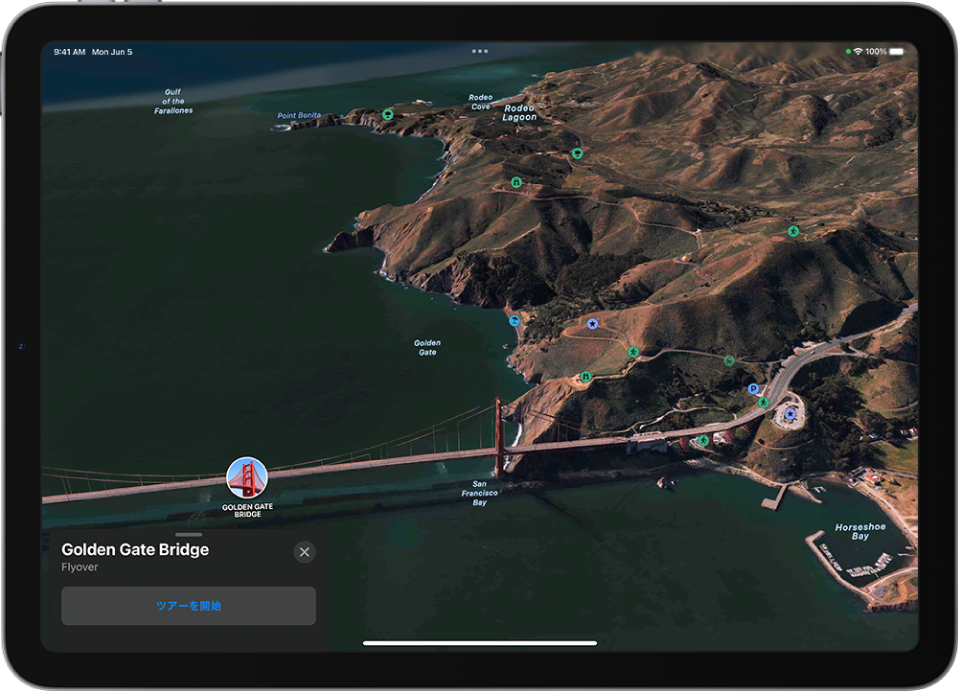 進行中のFlyoverツアー。上空からランドマーク方向を見た3D画像と、ツアーを開始するボタンが表示されています。