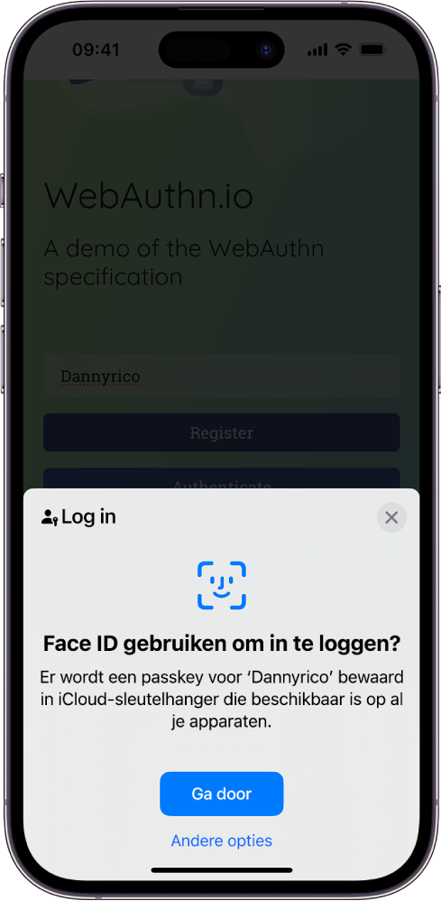 In de onderste helft van het iPhone-scherm staat de optie om met passkeys op een website in te loggen. Er is een knop 'Ga door' om een passkey te bewaren, en een knop 'Andere opties'.