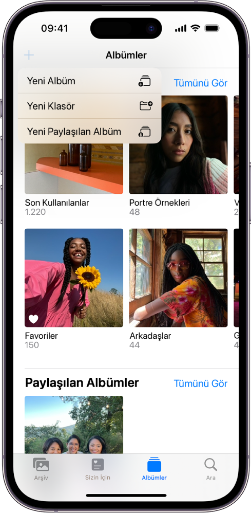 Albümler ekranı. Sol üst köşede Yeni Albüm düğmesi seçili ve yeni albüm, yeni klasör veya yeni paylaşılan albüm ekleme seçeneklerini gösteriyor.
