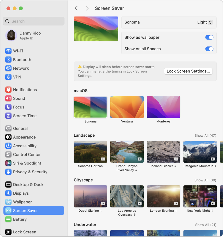 「系統設定」視窗，其中側邊欄中已選取「螢幕保護程式」設定，而右側則已選取「macOS Sonoma（淺色）」。