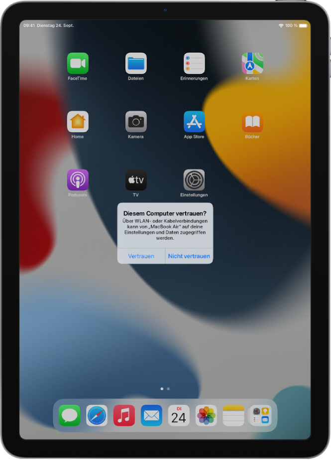 Auf einem iPad wird das Dialogfenster „Diesem Computer vertrauen?“ angezeigt, wenn es das erste Mal mit einem MacBook Pro verbunden wird.