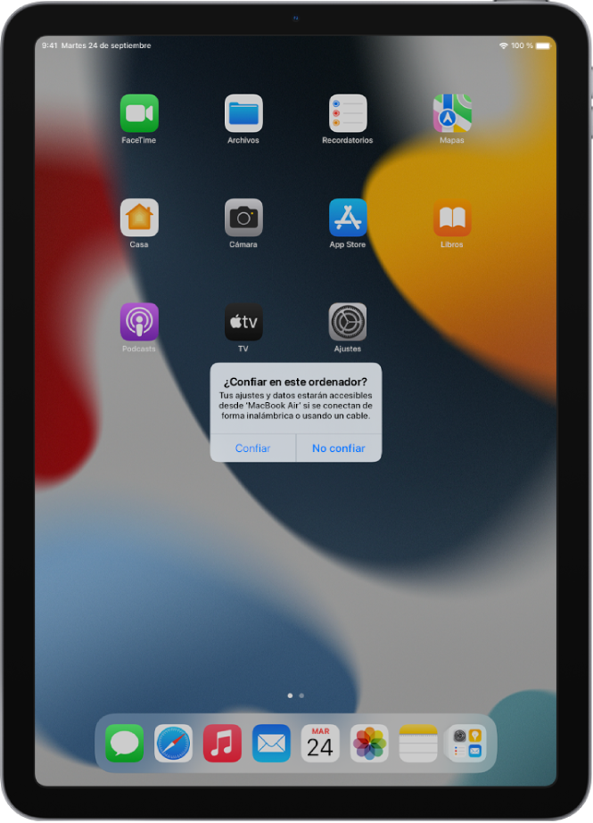 Un iPad con el cuadro de diálogo “¿Confiar en este ordenador?” cuando se conecta por primera vez a un MacBook Pro.