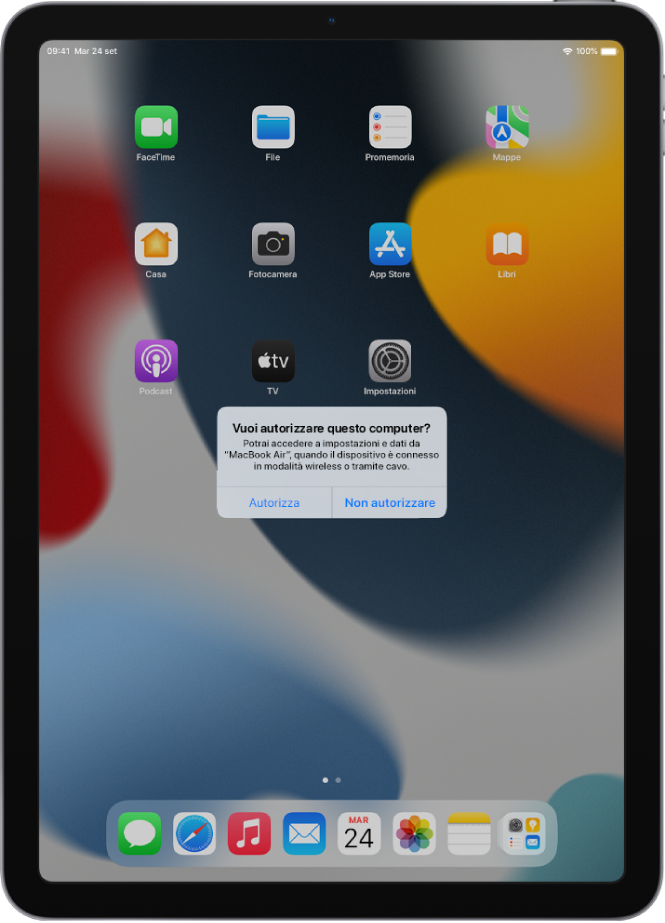 Un iPad che mostra la finestra di dialogo “Vuoi autorizzare questo computer”? quando viene connesso per la prima volta a MacBook Pro.
