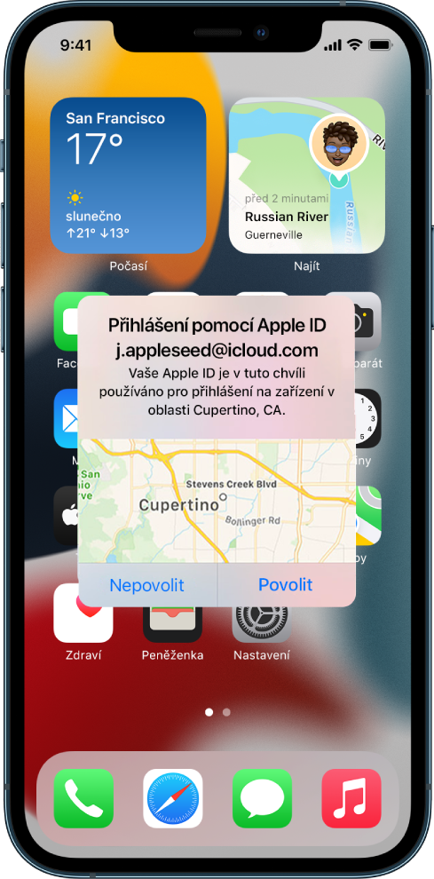 Displej iPhonu s oznámením o pokusu o přihlášení uživatele k jinému zařízení přidruženému k účtu na iCloudu