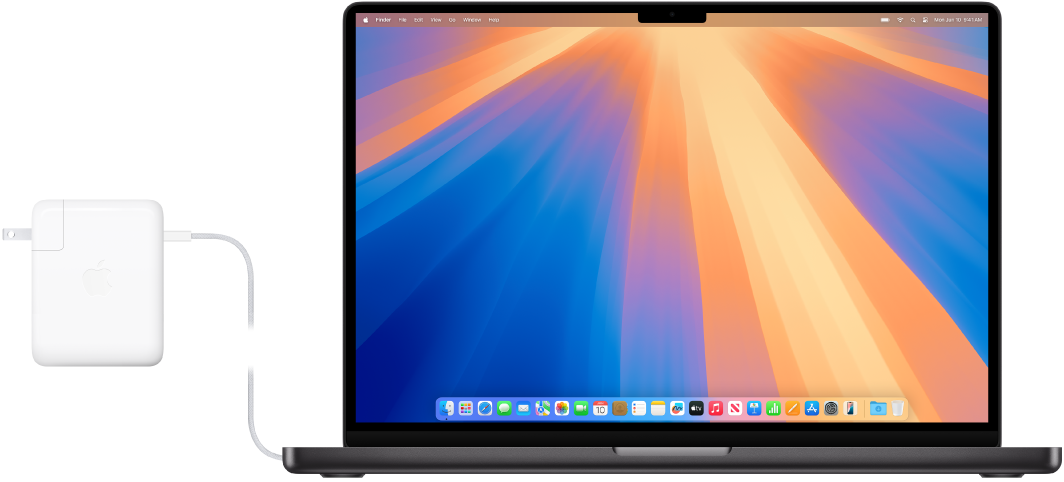 ‏MacBook Pro مقاس 16 بوصة موصول بمحول الطاقة.