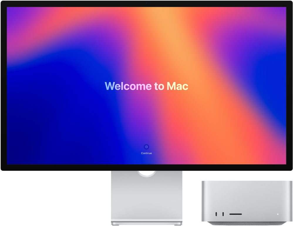 Studio Display un Mac Studio dators ar ekrānā redzamu “Welcome to Mac”.