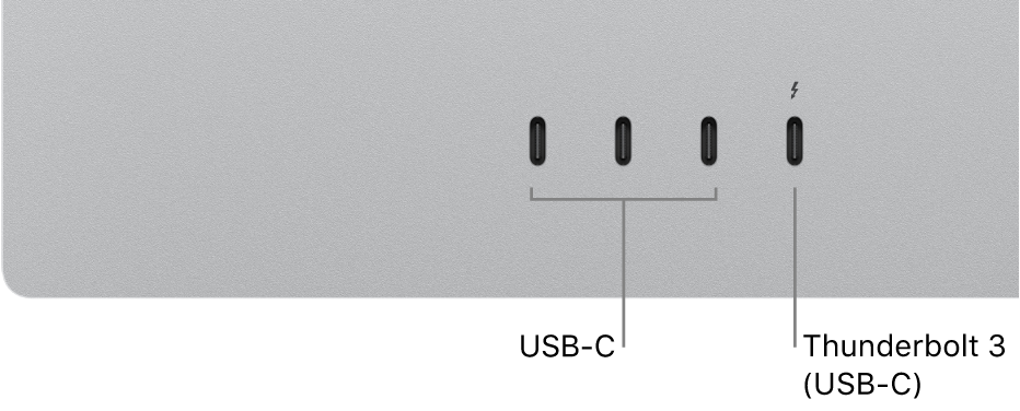 A close-up of the back of Studio Display showing three USB-C ports on the left and a Thunderbolt 3 (USB-C) port to their right.