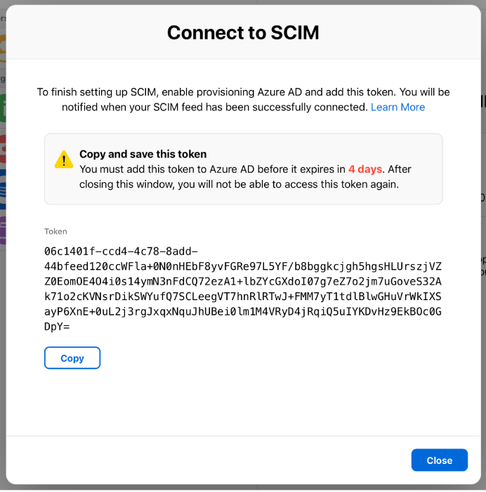 An alert titled “Connect to SCIM”, showing a token (to be copied to Azure AD) and a Close button.