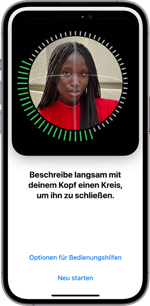 Der Konfigurationsbildschirm für die Face ID-Erkennung. Auf dem Bildschirm ist ein Gesicht zu sehen, das von einem Kreis umgeben ist. Der Text darunter weist den:die Benutzer:in an, den Kopf langsam zu bewegen, um den Kreis zu schließen. Die Tasten „Optionen für Bedienungshilfen“ und „Neu starten“ befinden sich unten auf dem Bildschirm.