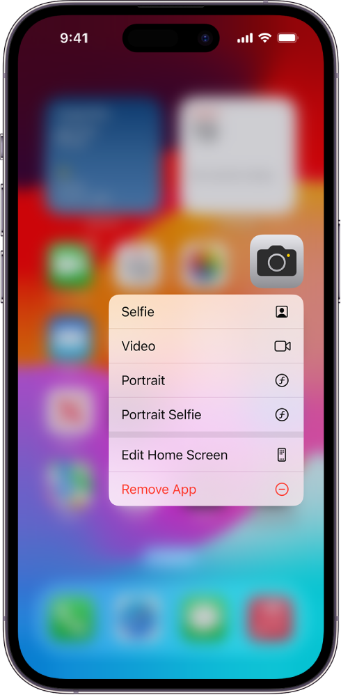 A blurred Home Screen, with the Camera quick actions menu showing below the Camera app icon.