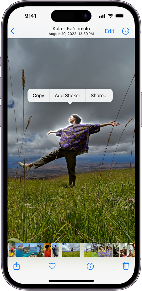 The Photos app is open to a photo of a person. The person is selected, and the option Add Sticker is available in the menu above.