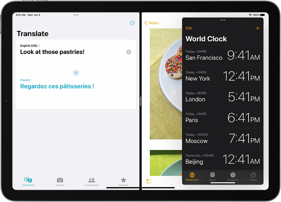 The Translate app is open on the left side of the screen, Notes is open on the right, and Clock is open in a Slide Over window that partially covers Notes.