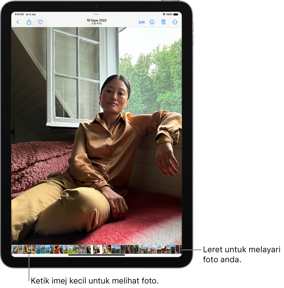 App Foto menunjukkan foto dalam skrin penuh. Di bahagian bawah skrin ialah imej kecil foto lain daripada pustaka.