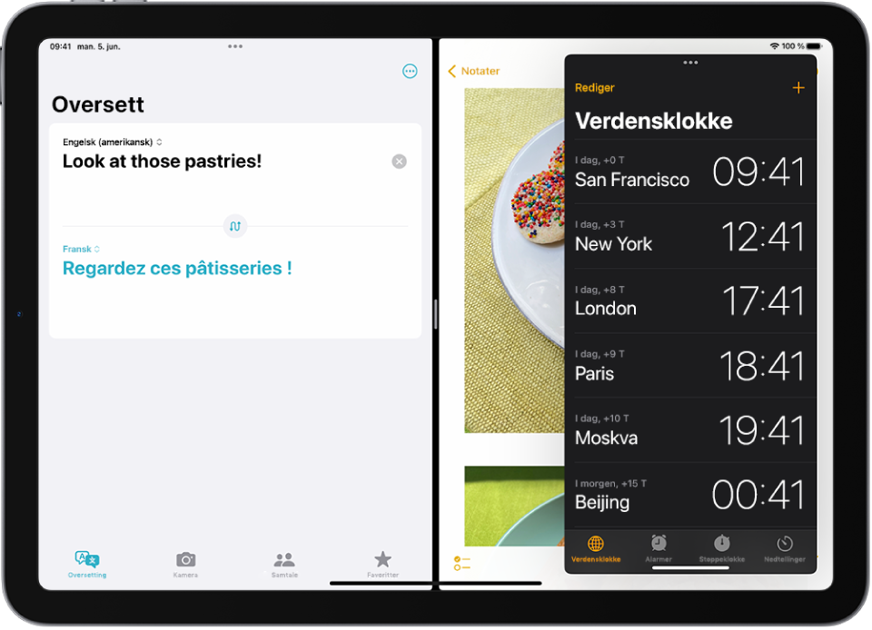 Oversett-appen er åpnet på venstre side av skjermen, Notater-appen er åpnet til høyre, og Klokke er åpnet i et Slide Over-vindu som delvis dekker Notater-appen.