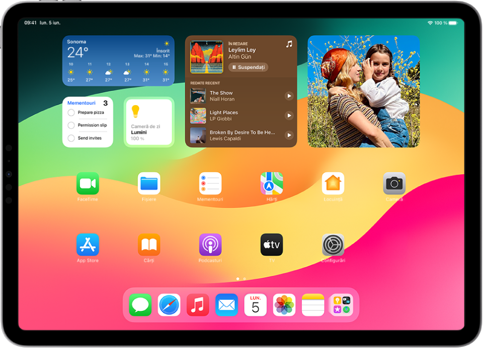 Ecranul principal al iPad-ului, cu mai multe pictograme de aplicații, inclusiv pictograma aplicației Configurări, pe care o puteți apăsa pentru a modifica volumul sunetelor de pe iPad, luminozitatea ecranului etc.