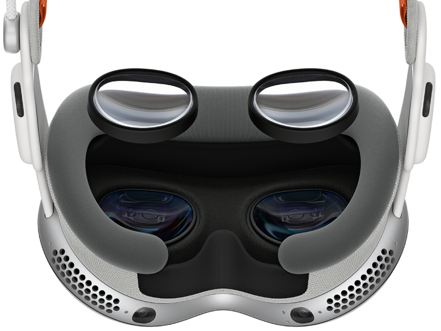 Apple Vision Pro with ZEISS Optical Inserts over the device, to show where they should be attached.