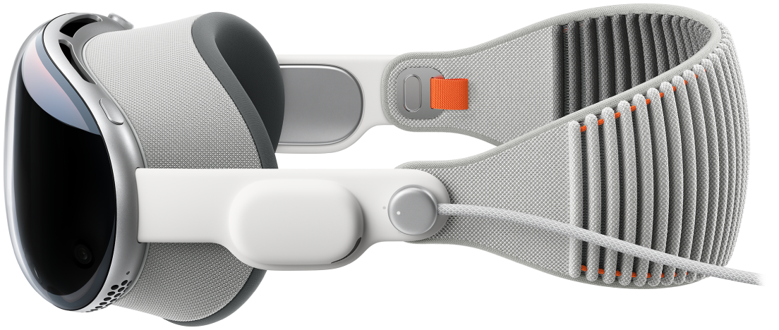 A side view of Apple Vision Pro, with the Solo Knit Band attached. The battery is attached to the left Audio Strap.