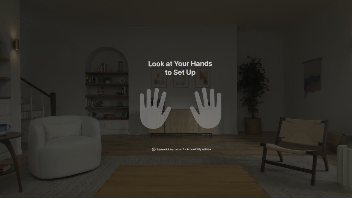 Hand setup on Apple Vision Pro, instructing the user to look at their hands in front of them.