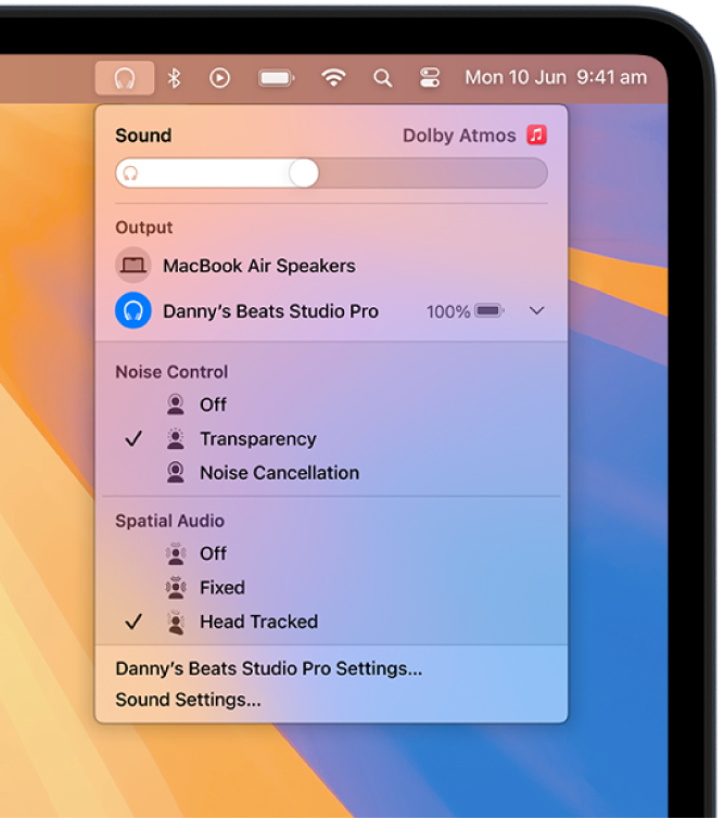 The Beats icon is selected in the upper right of the menu bar on Mac. A menu shows Beats Studio Pro with Transparency and head-tracked Spatial Audio on.