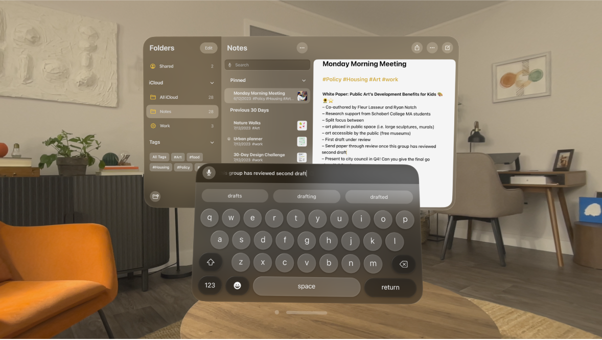 A user’s view on Apple Vision Pro. The Notes app is open and a note is being edited with the virtual keyboard. The preview of the text being edited is visible at the top of the keyboard.