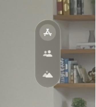 La vue d’accueil de visionOS. La barre d’onglets se situe à gauche des icônes des apps.