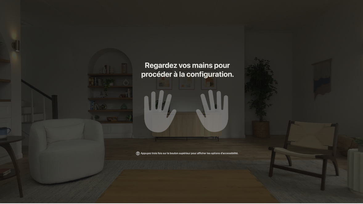 Configuration des mains sur l’Apple Vision Pro, demandant à la personne utilisatrice de regarder ses mains devant elle.