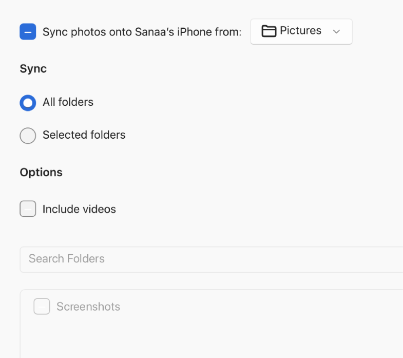“All photos and albums” and Selected albums radio buttons appear with “Only favourites”, “Include videos” and “Automatically include photos from” tick boxes below.