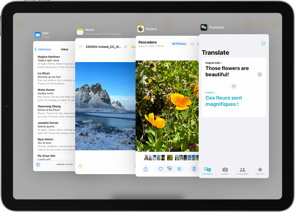 Quattro app aperte in finestre Slide Over, tra cui Mail, Foto, Traduci e Note.