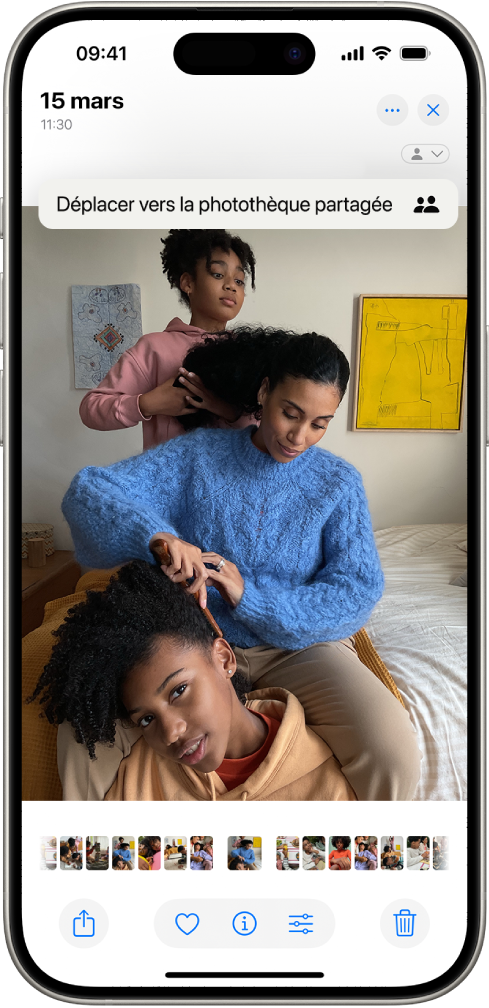 Une photo est ouverte dans l’app Photos. En haut à droite de l’écran se trouve une option pour déplacer la photo vers la photothèque partagée.
