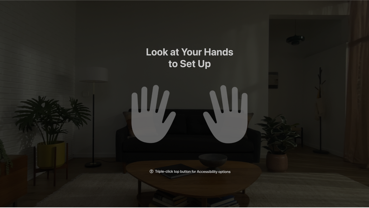 Hand setup on Apple Vision Pro, instructing the user to look at their hands in front of them.