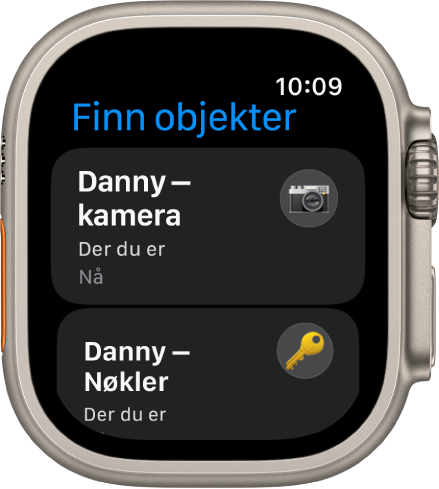 Finn objekter-appen som viser at AirTagene som henger på et kamera og et nøkkelknippe, er sammen med deg.