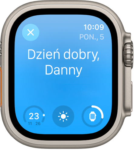 Apple Watch wyświetlający ekran pobudki. Na górze widoczny jest napis Dzień dobry. Poniżej widoczny jest poziom naładowania baterii.