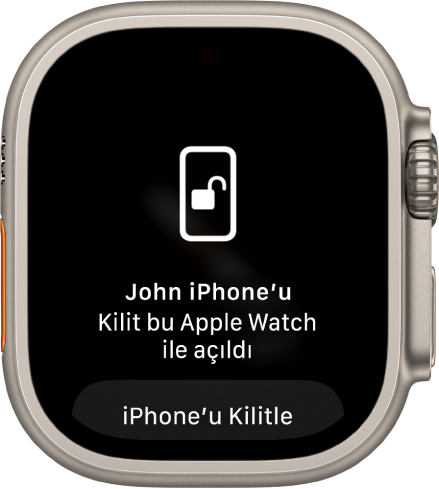 “Ali’nin iPhone’unun kilidi bu Apple Watch tarafından açıldı” sözcüklerini gösteren Apple Watch ekranı. iPhone’u Kilitle düğmesi altındadır.