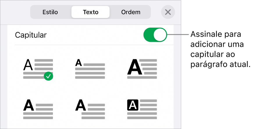 Os controlos de "Capitular” no menu “Texto”.