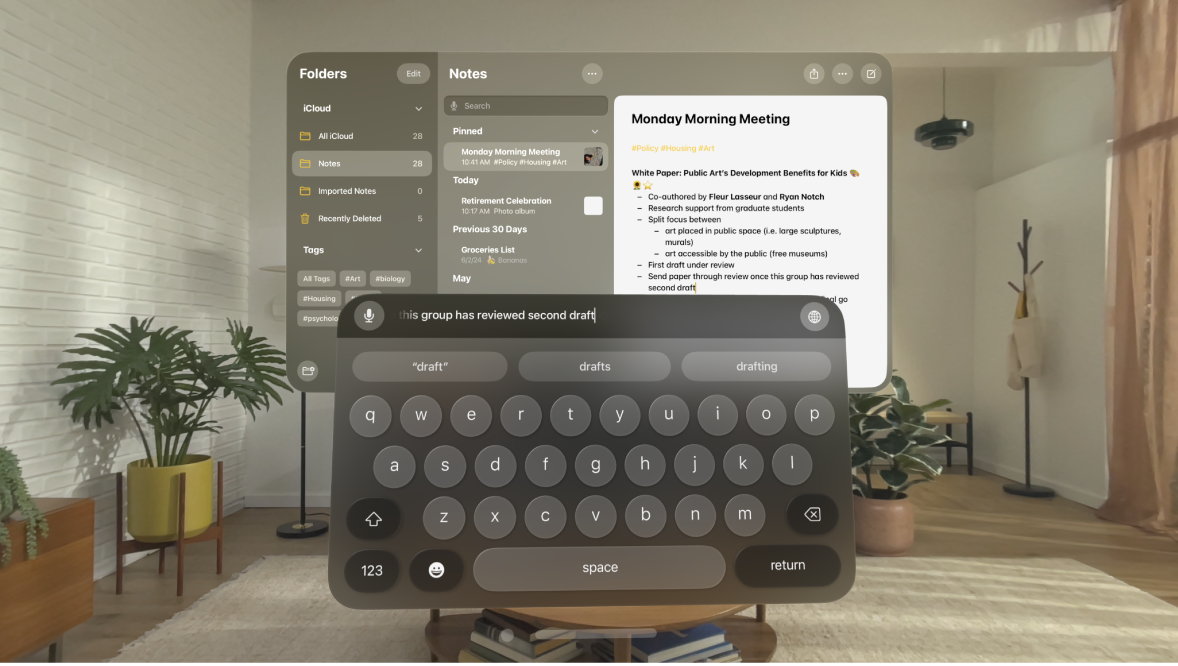 A user’s view on Apple Vision Pro. The Notes app is open, and a note is being edited with the virtual keyboard. The preview of the text being edited is visible at the top of the keyboard.