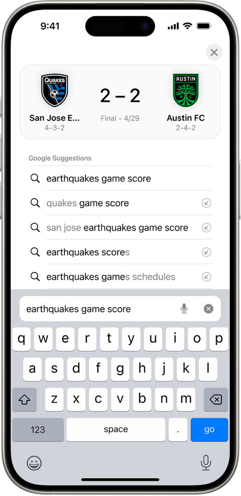 A Safari search screen, with the onscreen keyboard at the bottom of the screen. Above the keyboard, the search field contains the text “earthquakes game score.”