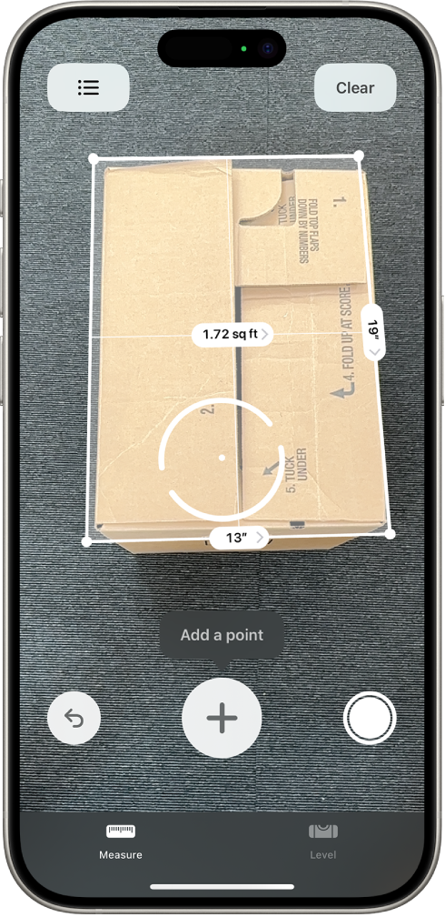 A screen showing the measurement of the dimensions of a box in the Measure app. The area of the box is calculated from the measurements of the dimensions.