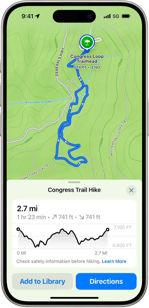 Un mapa topográfico en la app Mapas mostrando una ruta de senderismo. En la parte inferior de la pantalla hay una gráfica de elevación, el botón Agregar a biblioteca y el botón Cómo llegar.