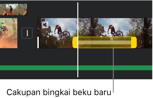 Bingkai beku dengan pengendali cakupan kuning ditampilkan di bagian bawah klip video di garis waktu, dengan awal bingkai beku di posisi playhead.