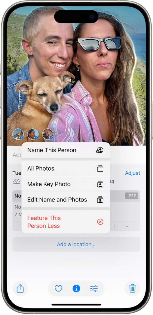 The top half of the iPhone screen shows a photo open in the Photos app. In the bottom-left corner of the photo are question marks next to the people and pets that appear in the photo. A question mark is selected and a menu of options includes, from top to bottom, Name This Person, All Photos, Make Key Photo, Edit Name and Photos, and Feature This Person Less.